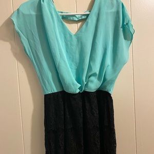 Teal dress. Fitted at bottom.